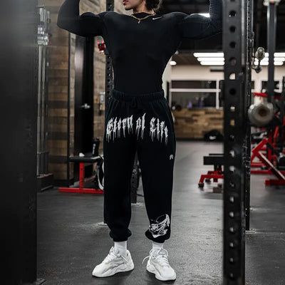 men's cotton gym joggers worn in a gym setting, showcasing style and performance for fitness enthusiasts.
